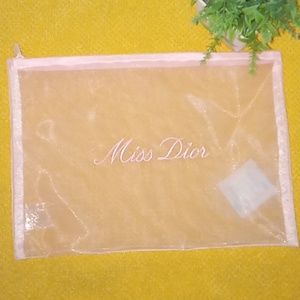 Dior Miss Dior Makeup Bag. Pink in color.